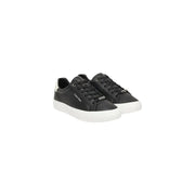 Calvin Klein black leather slip on sneakers for women with white rubber soles and a sleek minimalist design