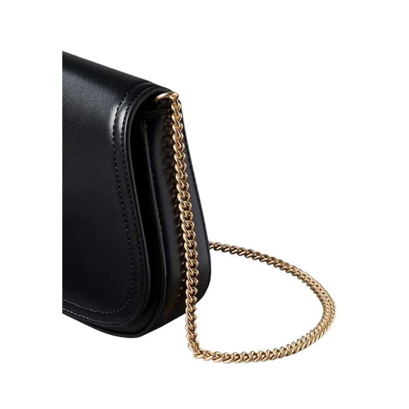 Calvin Klein black polyester shoulder bag with black leather crossbody design and gold-tone twisted chain strap
