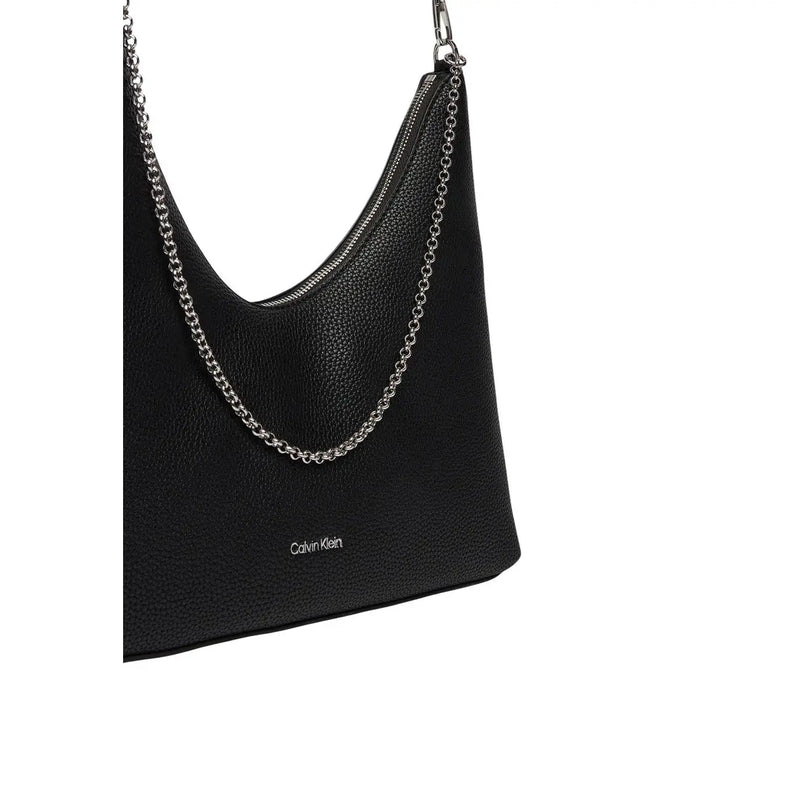 Calvin Klein black textured leather shoulder bag with silver chain strap and zip pocket for secure storage