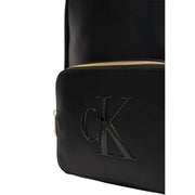 Calvin Klein black rucksack with glossy finish and gold-tone zipper featuring multiple zip pockets