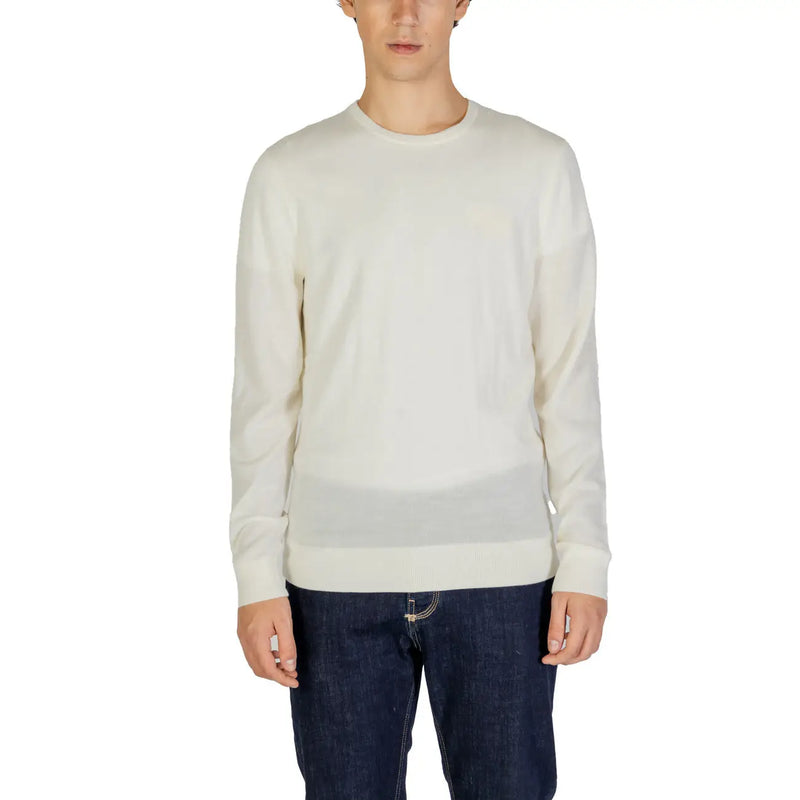 Cream-colored crewneck sweater with long sleeves and a relaxed fit.