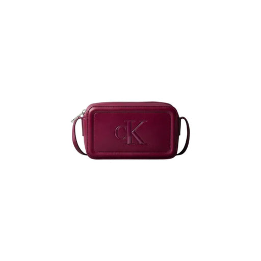Calvin Klein Bordeaux polyurethane zip bag in burgundy leather with embossed CK logo and interior pockets