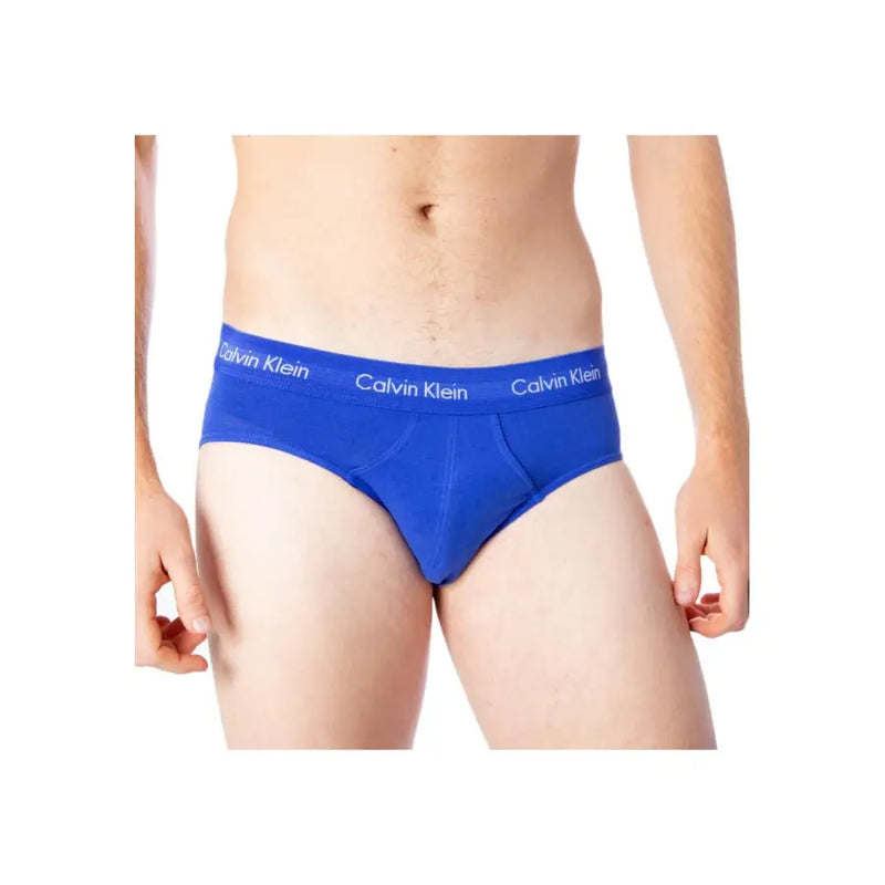 Blue calvin klein boys briefs featuring white branded waistband made from cotton elastane blend underwear