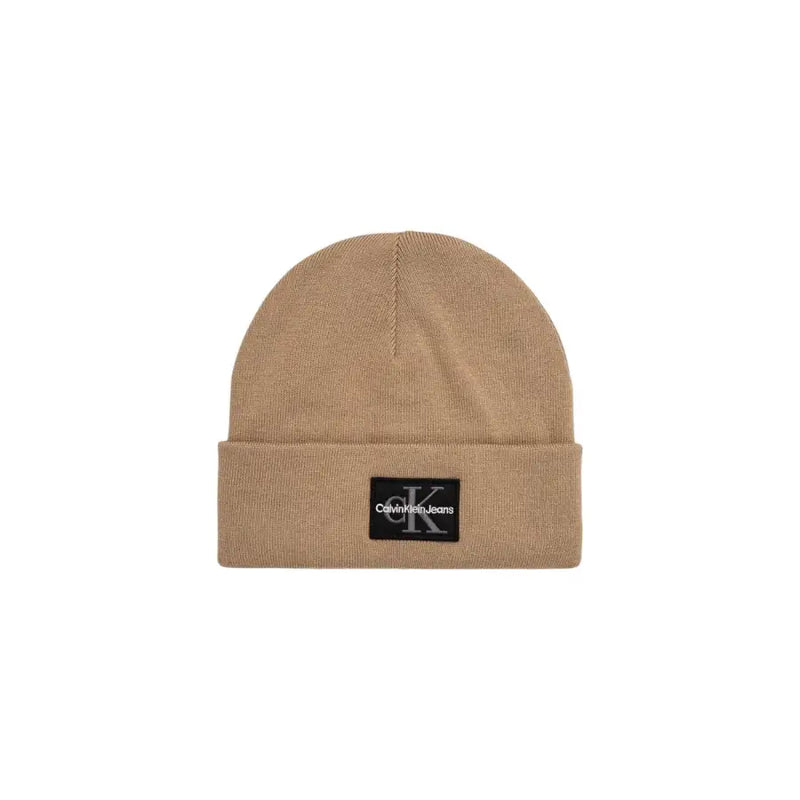 Beige calvin klein beanie with logo patch.
