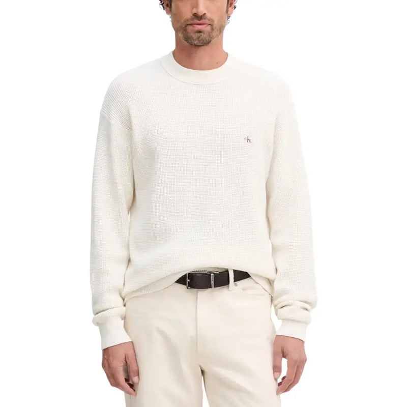 White textured crew neck sweater with logo detail on left chest.