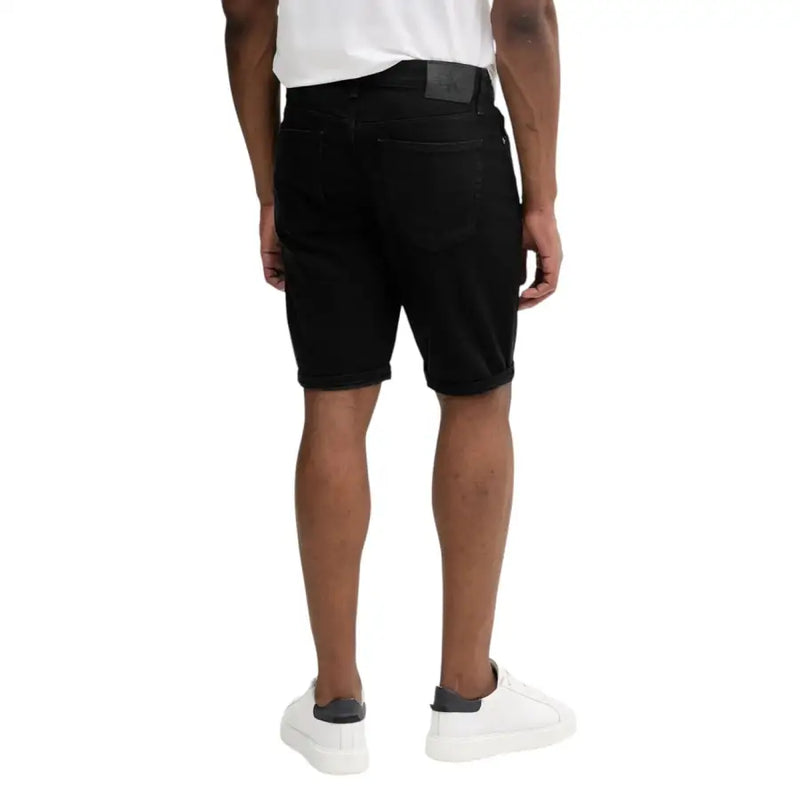 Calvin Klein Jeans black cotton stretch shorts for men featuring classic five-pocket design and rolled cuffs