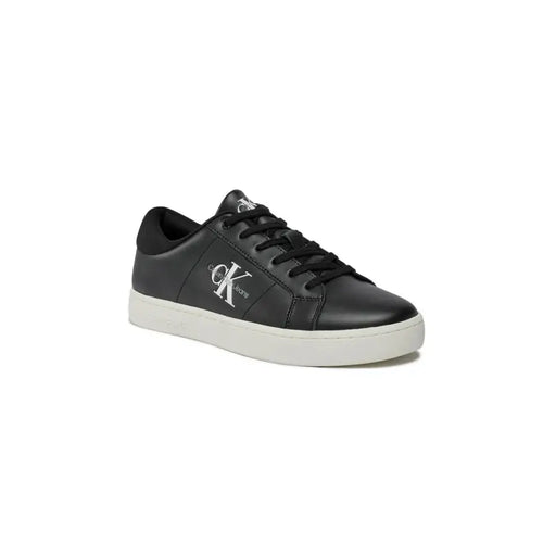 Black leather calvin klein sneaker with white logo and sole.