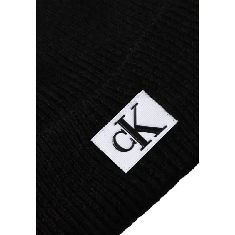 Calvin Klein Jeans black men’s ribbed knit beanie with white label and black ck logo fall winter collection