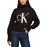 Calvin Klein Jeans black ribbed turtleneck knitwear for women with large white CK logo embroidered on chest