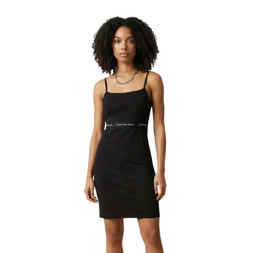 Calvin Klein jeans black sleeveless cotton dress with spaghetti straps and a white logo band across the waist