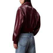 Calvin Klein Jeans Bordeaux long zip front women’s blazer in rich burgundy faux leather with cropped fit and ribbed cuffs