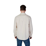 Beige long-sleeved cotton button-up shirt with classic collar and folded cuffs from Calvin Klein Jeans men spring summer collection