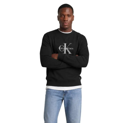 Calvin Klein Jeans men black cotton crewneck sweatshirt with white interlocking CK logo and calvin klein text on chest