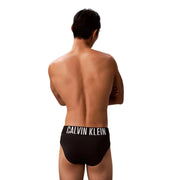Calvin Klein Jeans Herren schwarze Badehose aus Polypropylen mit weißem Logoband, Vorderansicht