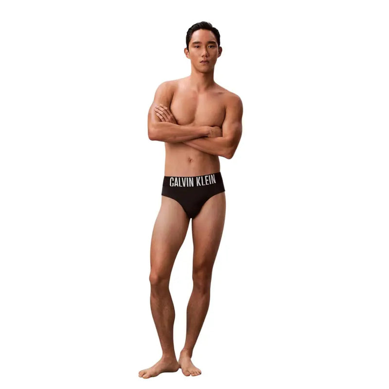 Schwarz Calvin Klein Jeans Herren-Badehose aus Polypropylen mit weißem Logoband am Bund