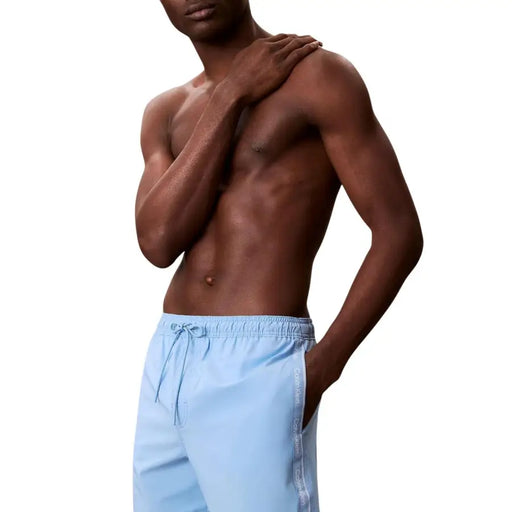 Light blue calvin klein jeans men swimwear polyester swim trunks with drawstring waistband and vertical branding