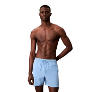Light blue polyester Calvin Klein Jeans men swim trunks with drawstring waistband for comfortable wear
