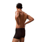 Schwarze Herren-Boxershorts mit elegantem, figurbetontem Design und dezentem Logo am Bund, Calvin Klein Jeans-Trunk, schwarze Badebekleidung