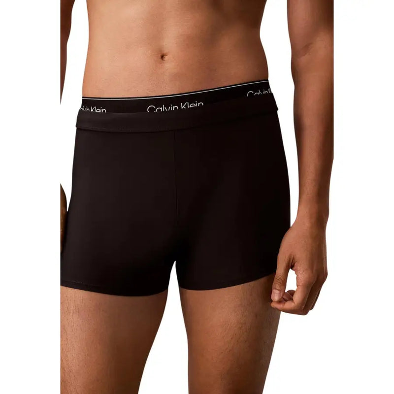 Calvin Klein Jeans Schwarze Herren-Badehose mit doppeltem Bund, bestehend aus schwarzen Boxershorts mit weißem Logoband
