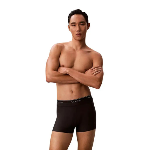 Calvin klein jeans men double waistband trunk black swimwear with black boxer briefs and subtle white logo waistband