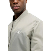 Calvin Klein Jeans men green polyamide zip blazer with a light gray bomber jacket featuring a subtle white embroidered logo