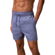 Light blue Calvin Klein swim trunks with matching elastic waistband and drawstring for men casual swimwear