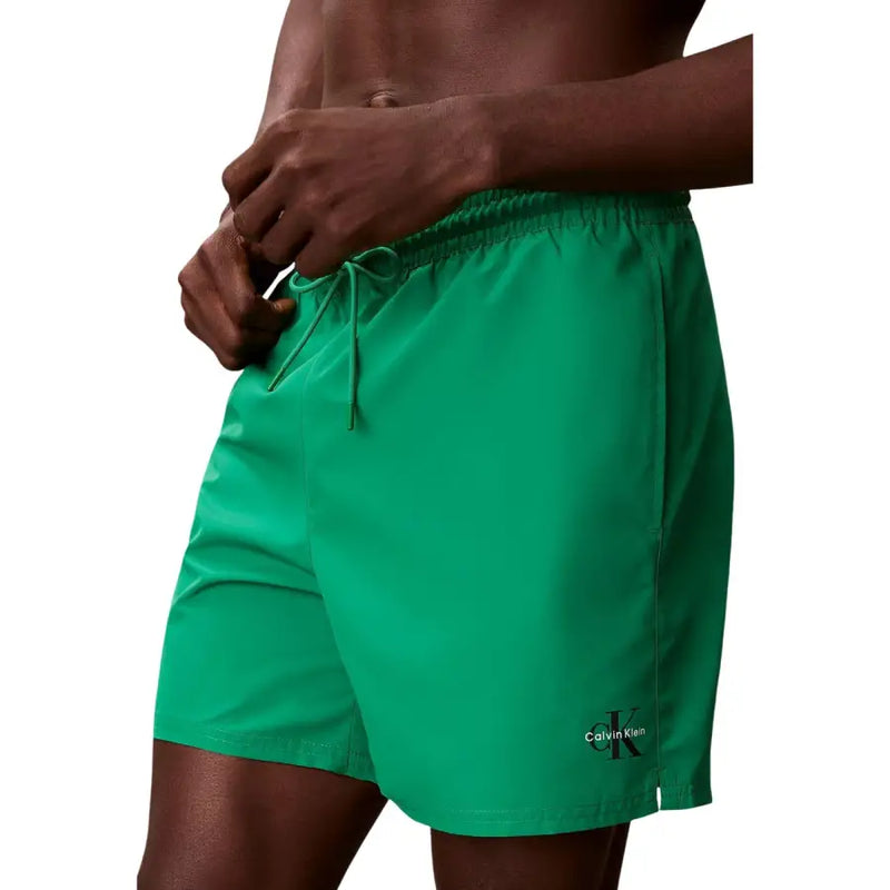 Calvin Klein Jeans Herren-Badeshorts aus Polyester, mittelgrau, mit leuchtend grünem Muster Calvin Klein Badehose und Kordelzugbund