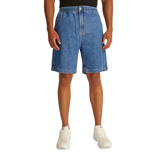 Denim shorts with an elastic waistband and button fly, light blue in color.