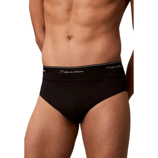 Black Calvin Klein Jeans men’s swimwear briefs with white logo waistband for swimming and casual wear