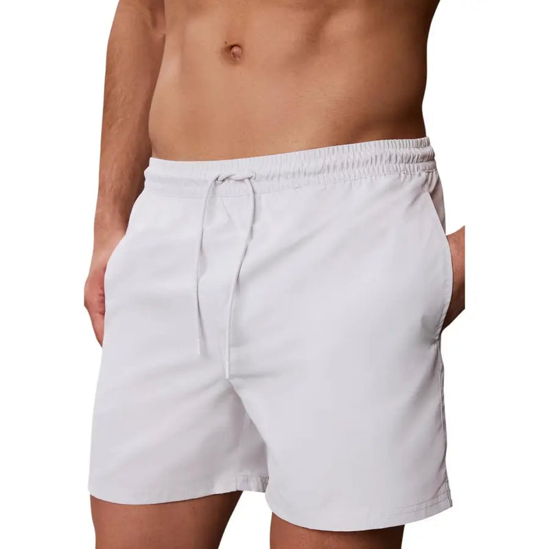White lightweight swim trunks with elastic waistband and drawstring for men by calvin klein jeans swimwear