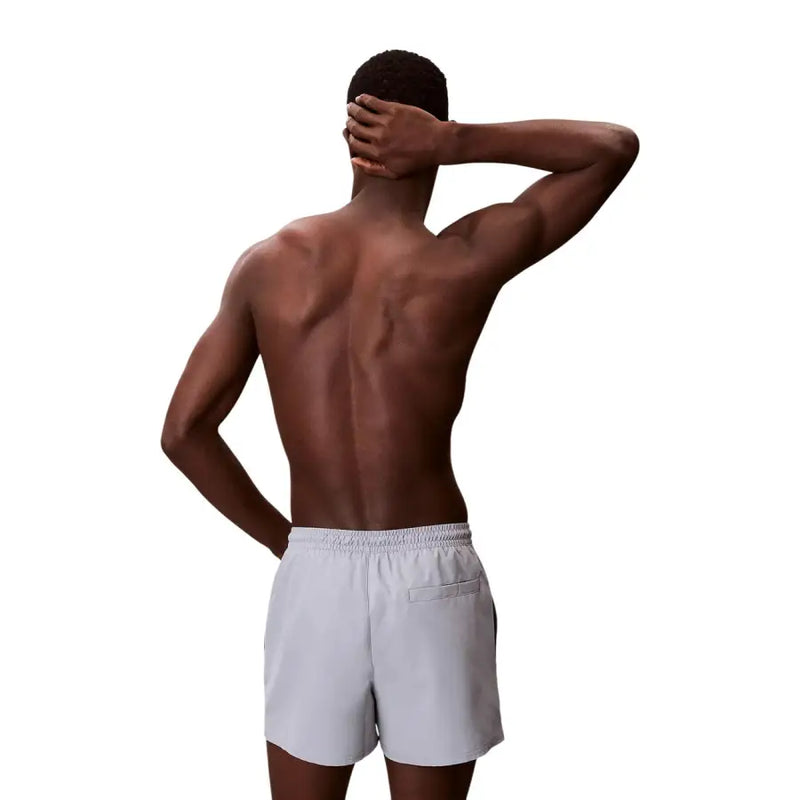 Light gray Calvin Klein Jeans men swimwear shorts with elastic waistband and small side pocket