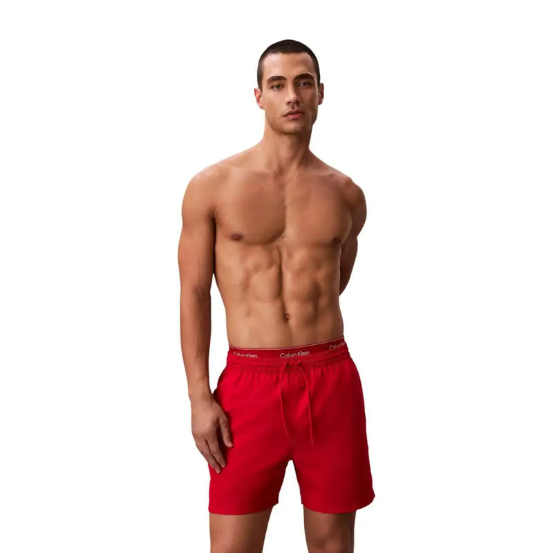 Calvin Klein Jeans men swimwear red swim trunks with drawstring waistband designed for comfortable beachwear