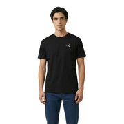 Calvin Klein Jeans Männer t-shirt aus schwarzem Baumwollstoff mit einem kleinen weißen CK-Logo auf der linken Brust