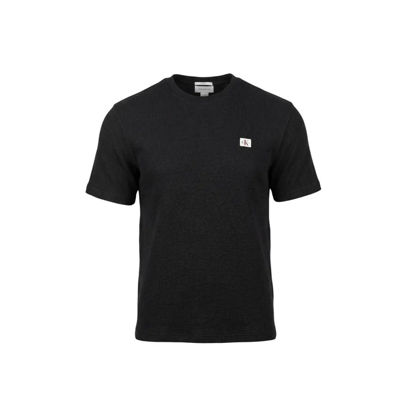 Black Calvin Klein Jeans men t-shirt with ribbed texture and small white logo patch on left chest