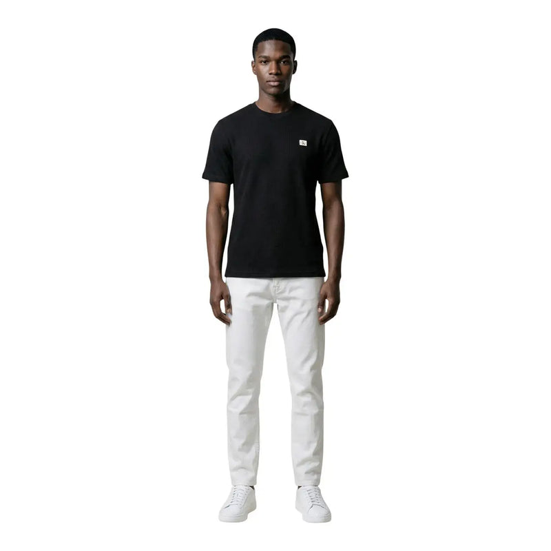 Black Calvin Klein Jeans men t-shirt with a small white logo on the left chest in short sleeves