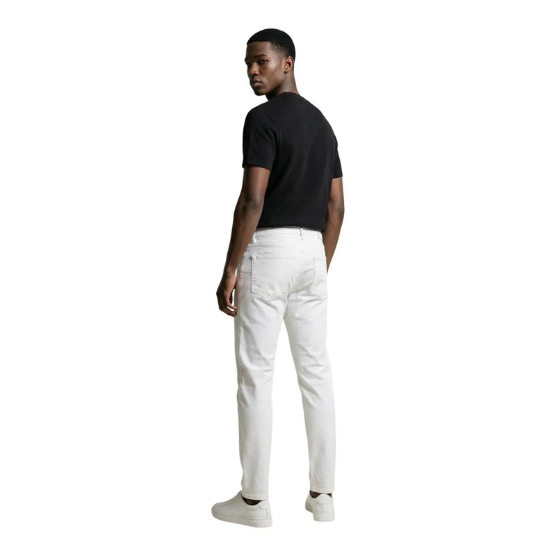 White slim-fit denim jeans by calvin klein jeans for men showcasing a modern casual style