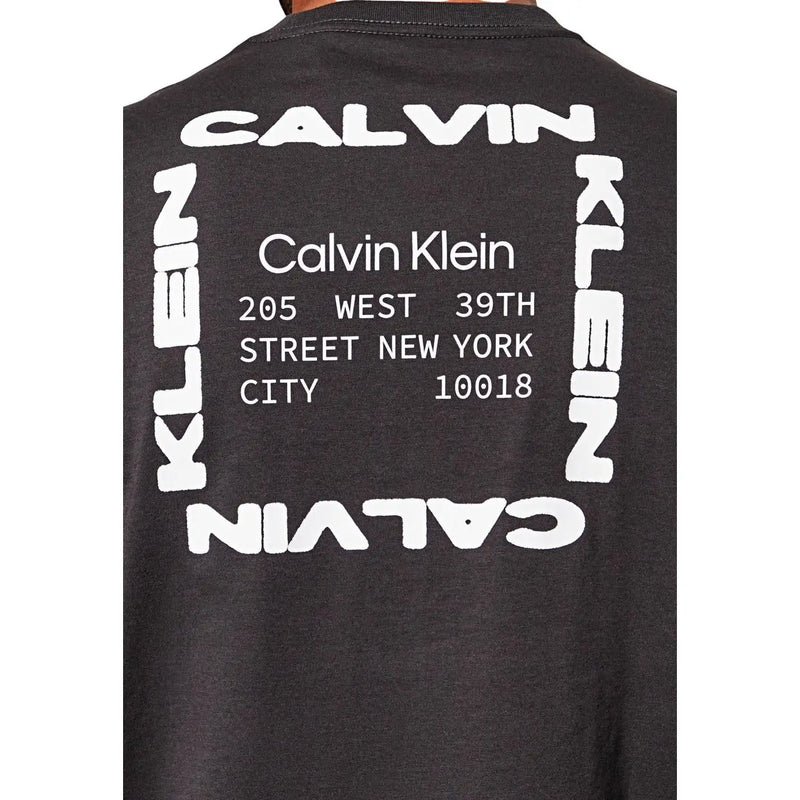 Black Calvin Klein Jeans men t-shirt with bold white graphic and modern font displaying brand name and New York address