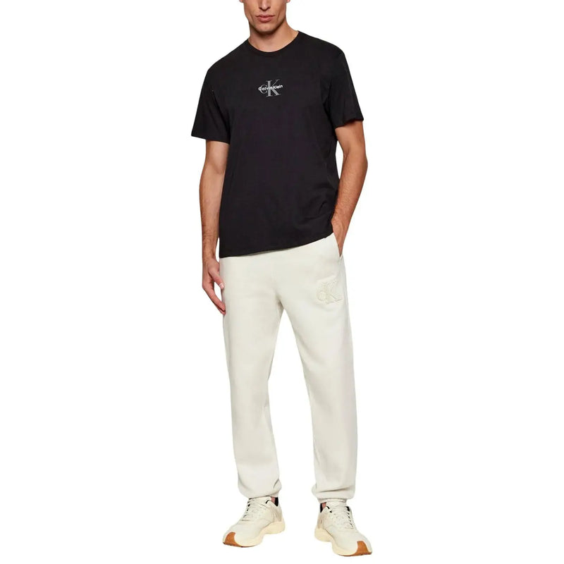 Black Calvin Klein Jeans men t-shirt with white logo on chest made from comfortable cotton fabric
