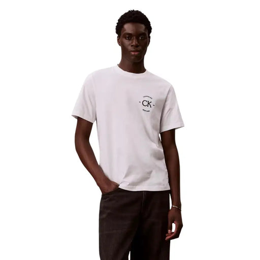 Calvin Klein Jeans men white cotton t shirt with black circular logo on chest and round neck design