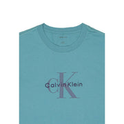 Light blue Calvin Klein Jeans men t-shirt featuring a subtle purple CK logo printed across the chest