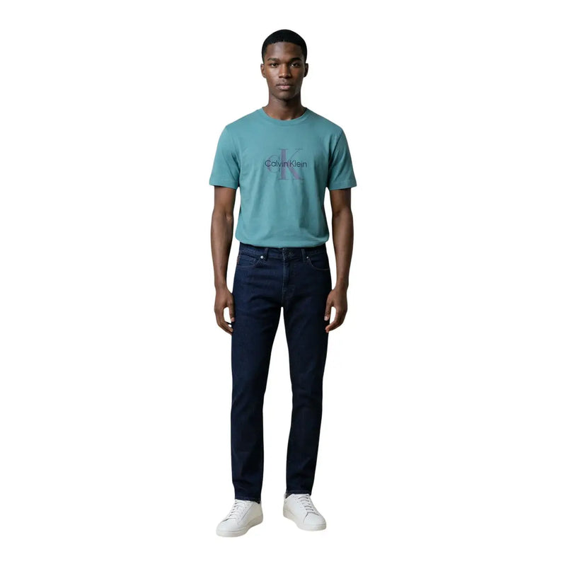 Teal calvin klein jeans men t-shirt with subtle faded logo on chest made from soft cotton fabric