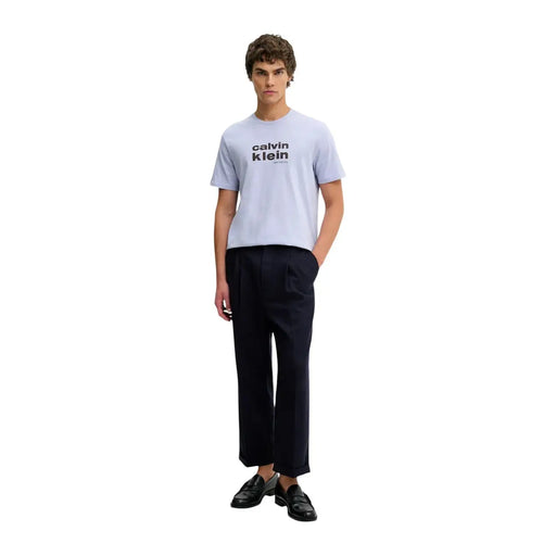 Light blue calvin klein jeans men t shirt with black logo print made of lilac cotton with round neck