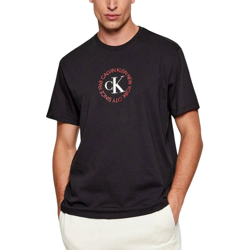 Black Calvin Klein Jeans men t-shirt with circular white and pink ck logo on the front