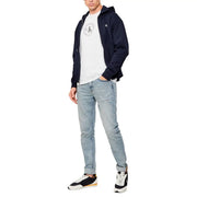 Navy blue Calvin Klein Jeans zip-up hoodie with white circular logo on chest and matching emblem on left sleeve