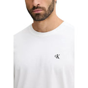 White Calvin Klein Jeans crewneck t-shirt with small black embroidered CK logo on left chest for men