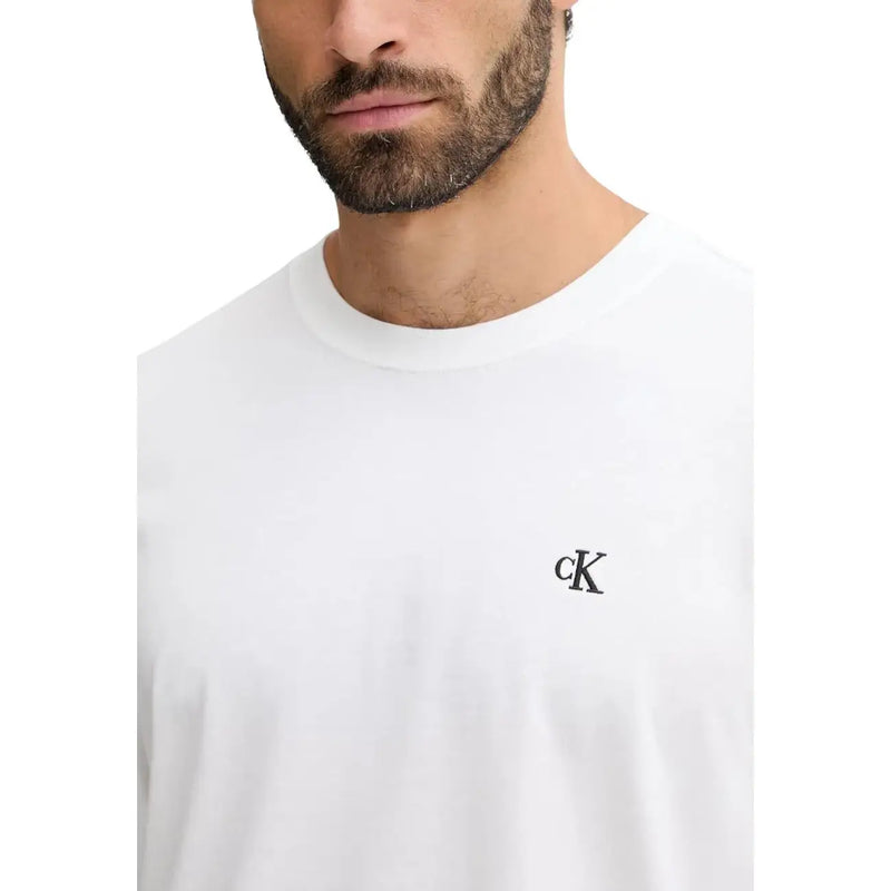 White Calvin Klein Jeans crewneck t-shirt with small black embroidered CK logo on left chest for men