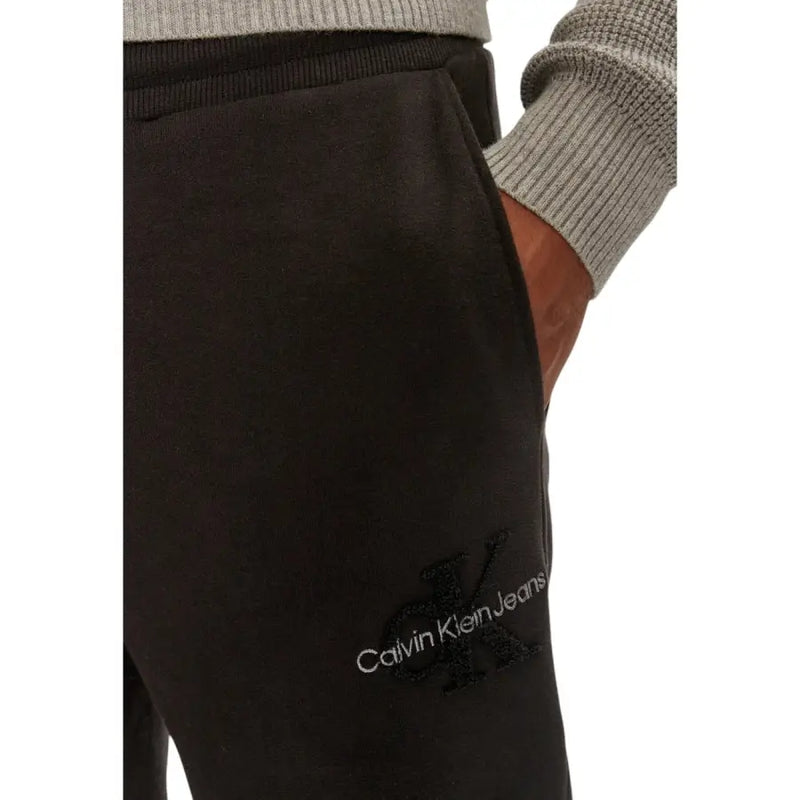 Black Calvin Klein Jeans sweatpants with white logo and embroidered CK monogram