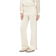 Calvin Klein Jeans Beige Baumwollhose für Damen mit cremefarbenem Trainingshöschen, Seitenschlitz und gesticktem Logo