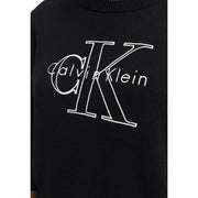 Schwarzer Calvin Klein Baumwollstrickpullover für Damen mit einem markanten weißen gestickten CK-Logo auf der Vorderseite
