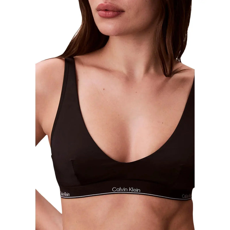 Calvin Klein Jeans women black halter bralette with sleek minimalist design and subtle white branding on the band